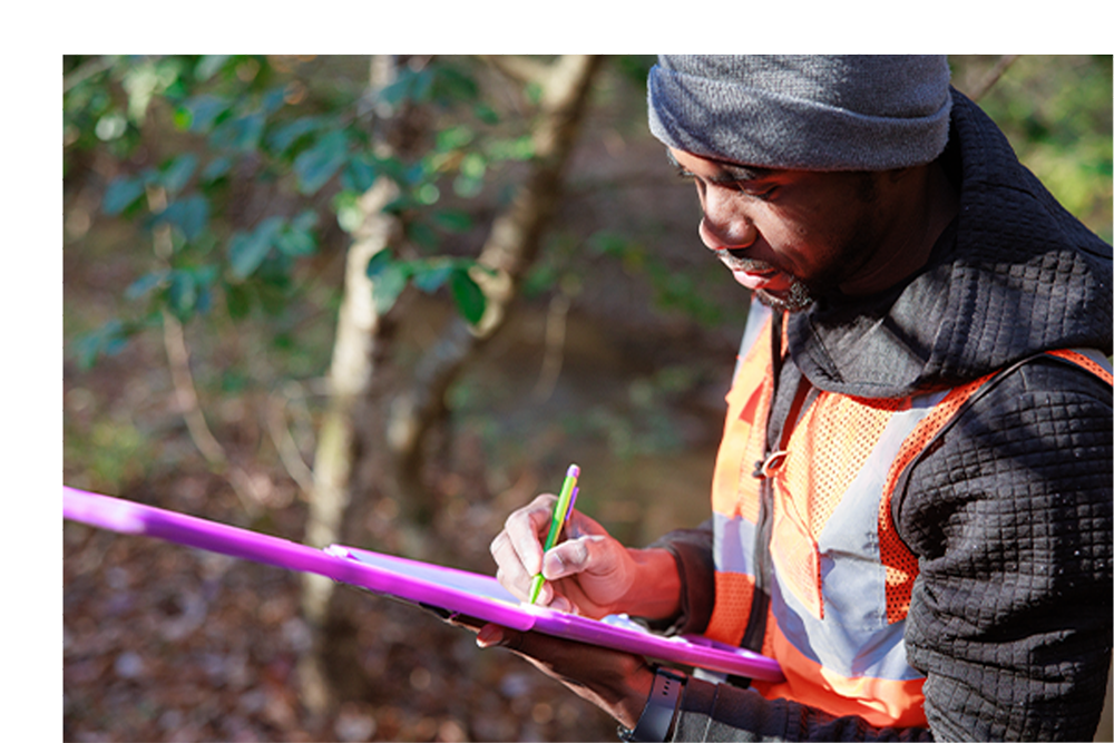researcher doing field research in a creek