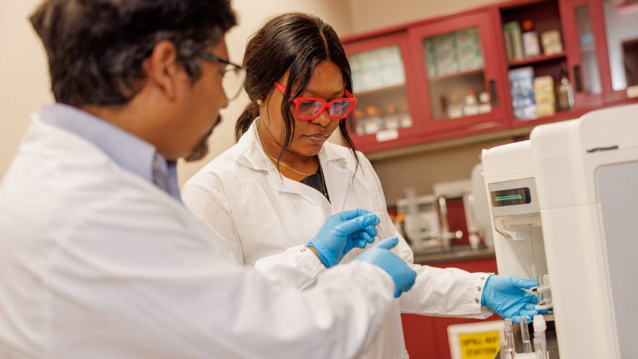 two researchers in the Center for Convergent Bioscience and Medicine